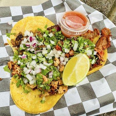 Steak, chicken, and al pastor tacos