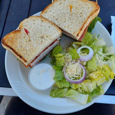 Cali Clubhouse sandwich. Loaded high with ham, turkey, lettuce, tomato, bacon and avocado on sourdough. Really good!