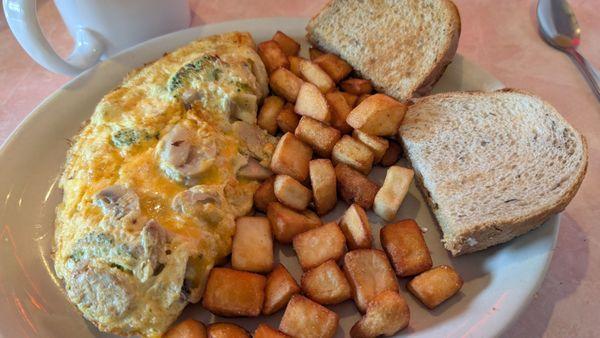 3 egg omelet with cheddar, broccoli, mushrooms with rye toast