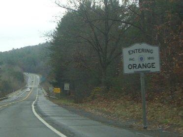 Entering Orange Massachusetts from Erving with Wendell sign in the distance.