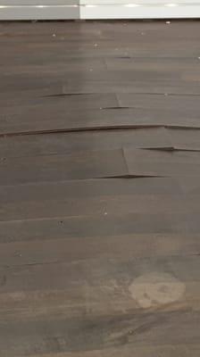 Defective warping peeling terrible flooring!