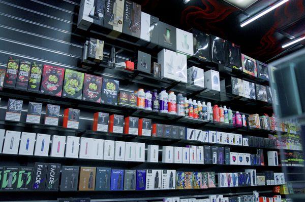Full vape wall packed with flavors and brands from disposables to kits, Red Wolf Smoke Shop keeps Redwood City stocked.