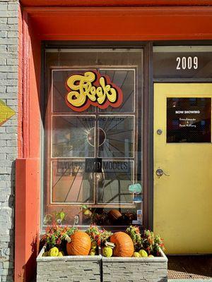 Flock Salon and Gallery's front door in the fall