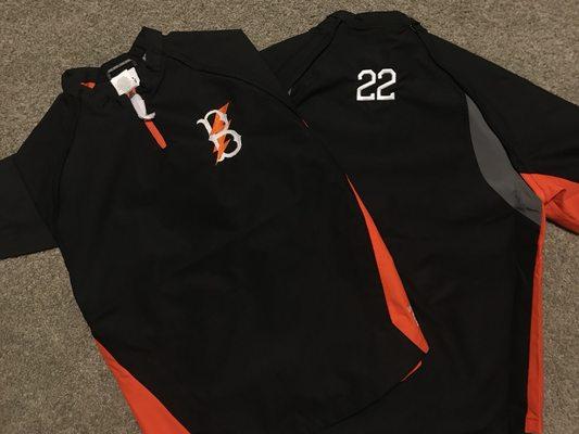 Team jacket with left chest logo and 3D athletic number below the back collar.