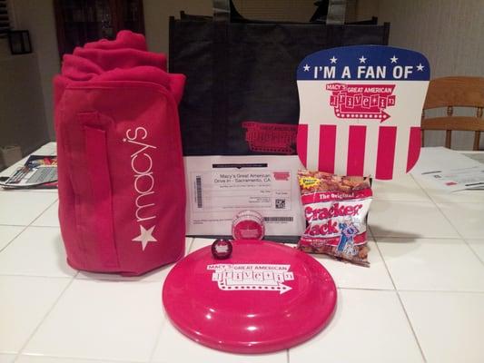 Elite Booty! Bag, blanket, fan, yo-yo, Cracker Jacks, frisbee, $10 Macy's card, light-up ring...score!