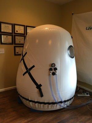 Hyperbaric Oxygen Chamber. (Notice just a small collection of the staffs many cerifications on the wall behind it)