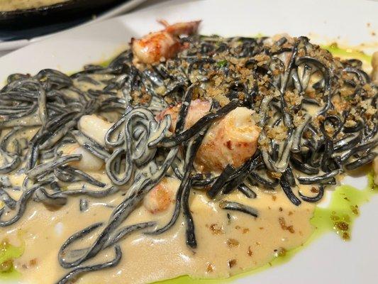 Spaghetti Neri - squid ink spaghetti, lobster cream sauce, lobster and shrimp, chive