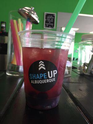 Peach tea with cranberry aloe with fresh blueberries and mangos.