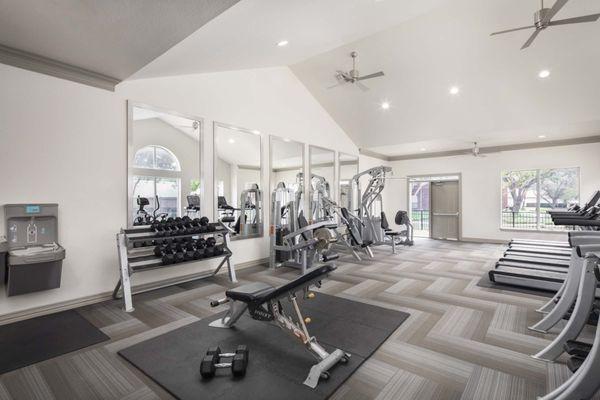 24-hour fitness center with strength equipment at Camden Buckingham apartments in Richardson, TX