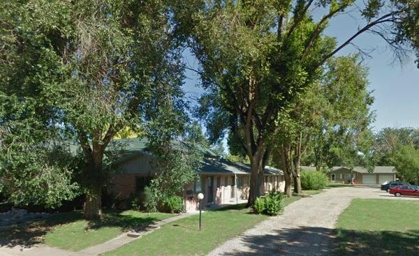 Another view of our quiet Conifer Apartments on West 10th Street in Loveland. Lush greenery, pleasant neighborhood.