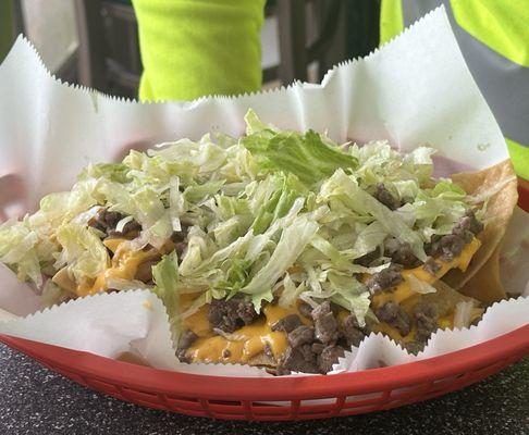 Beef nachos with only lettuce on top