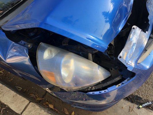 Parked car got hit by the other brown car that was either trying to backup or parallel park.