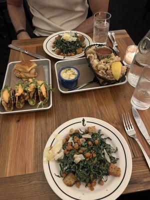 Fish tacos, shrimp and avocado slider, kale caesar salad, calamari, and clam chowder