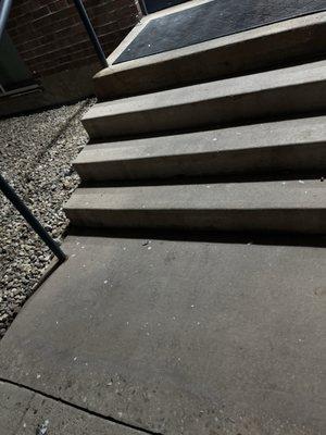 Broken light bulb left on the stairs