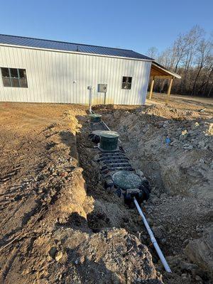 New septic system for a barndominum with a 1000 gallon septic tank and a 1000 gallon pump tank.