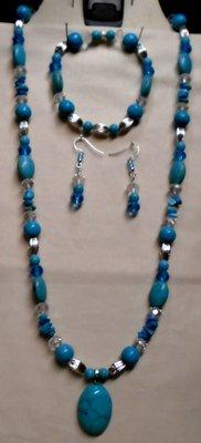 23 Inches Long
Oval Turquoise Cabochon Pendant. Stretch Bracelet
Silver Tone