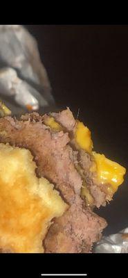 Patty cooked with someone's hair.