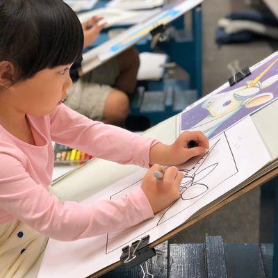 5-year-old Lexi focusing 100% on reinforcing the lines she learned to draw freehand.