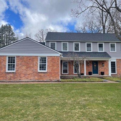 We installed CertainTeed CedarBoards Insulated Single 7" Lap in the color Granite Gray.