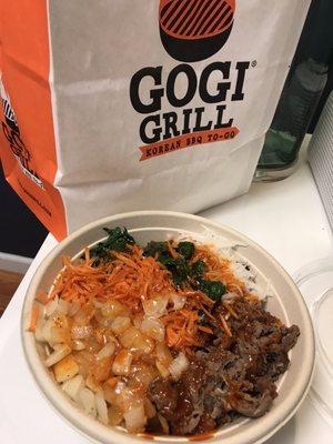 Beef bulgogi bowl with onions, carrots, pickled radish, spinach and gochujang (pepper paste) sauce. Heavy with water weight