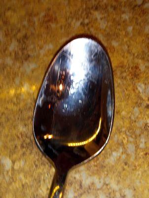 Notice the flaking of the silver off the bottom of this tablespoon made by Cambridge.
