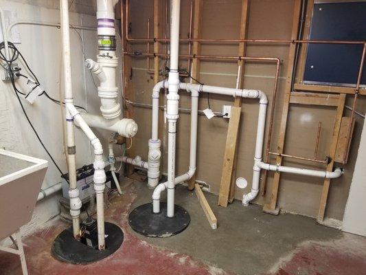 Installation of complete bathroom including shower, toilet and vanity sink. Installed ejector pump/pit and interfaced with overhead sewer