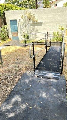 Securely bridged a cutaway section of the yard with a safe slope to the ramp.