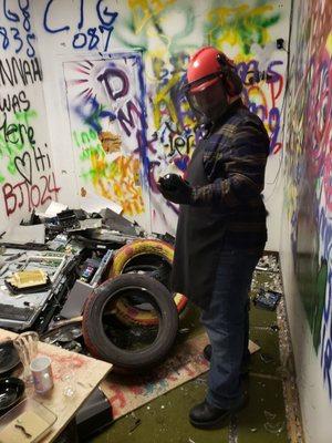 Looking at a glass skull he's ready to destroy