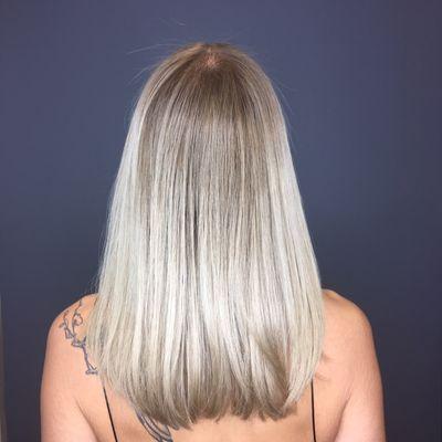 back view of black to platinum blonde w/ shadow root (multiple sessions)