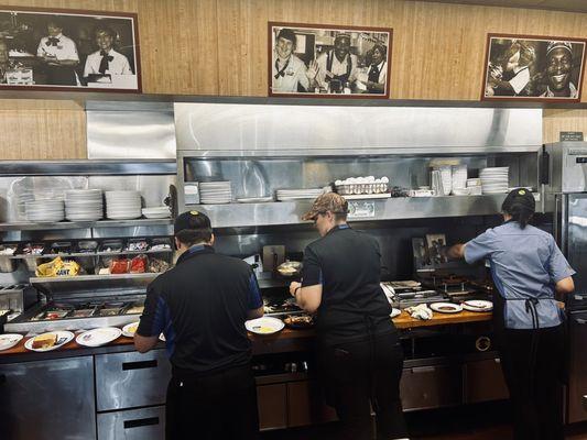 Gettin' it done! Sarah and crew keep the hot station moving!