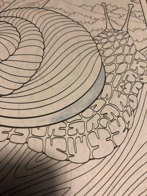 Kappa coloring book page, first try coloring using dark blue pencil. It does not adhere well to the paper, as if it was glossy! I am done!