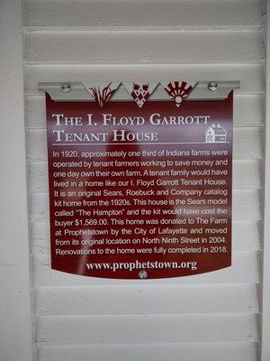 A sign explaining how the building was relocated to its current site and how the original owners ordered it from the Sears Catalog.