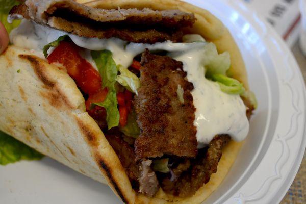 Enjoy our delicious 1/2 lb GYRO. Lettuce,tomato,onion,tzatziki sauce.Served on a warm soft pita shell. Add some curly fries or coleslaw.