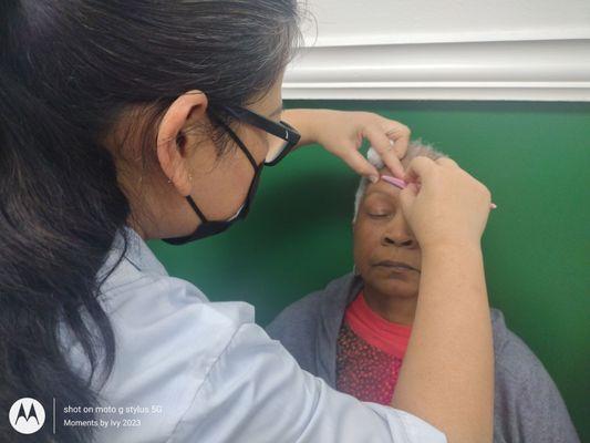 Mama getting her eyebrows arched! Her favorite place to come get this service 10/21/2023