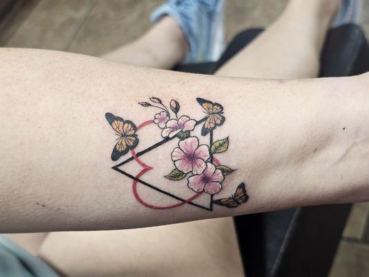 Adoption triangle with flowers and butterflies.