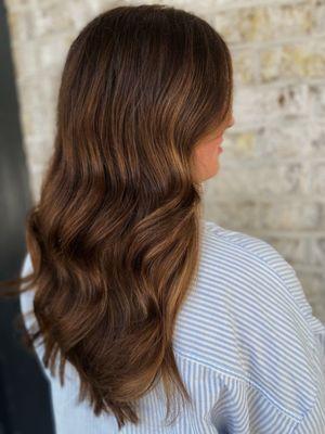 The gloss and haircut package warmed up this clients overall color story, creating richness and depth while staining her grey hair.