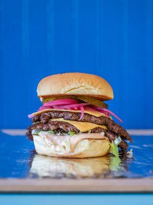 The Double Smash, for our big back pals! Twin smash patties, American cheese, lettuce, pickled onion, pickles and Heffer sauce