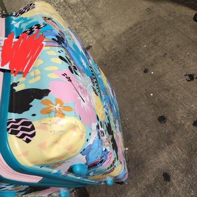 Dent and protective film all hanging off and damaged