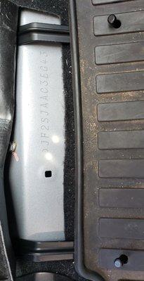 Mat hooks installed on passenger side.