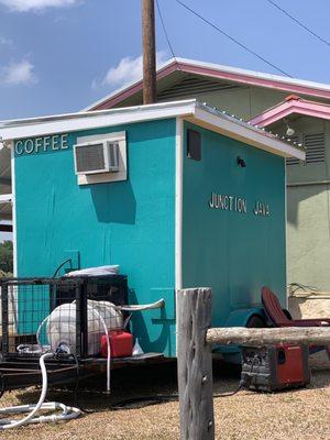 Little kiosk next to a country convenience store.