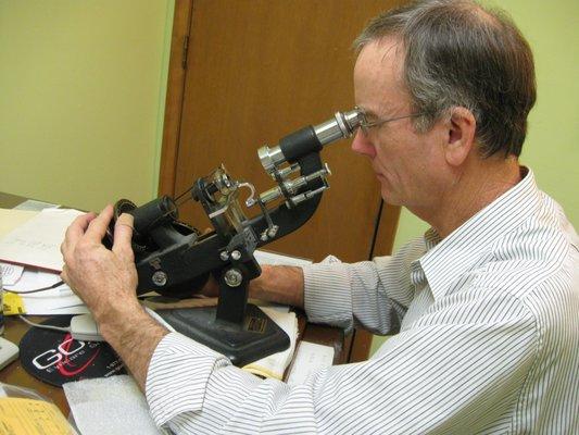 Dr. Felker verifies the prescription of every pair of glasses he prescribes.
