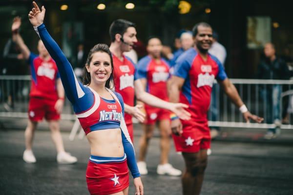Cheerleaders walking the streets as we stumble on another exciting street parade in NYC.