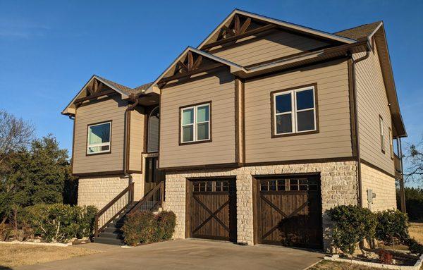 New Composite Ascend siding with real cedar trim and accents that replaced old vinyl siding.