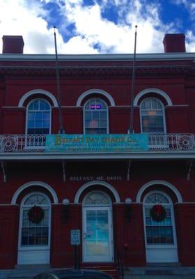 Part lamp shade factory and part US Post Office -- enter on the left.
