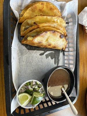 Quesabirrias Platillo. Difficult to eat, but satisfying. Minced red onion and cilantro on the side.