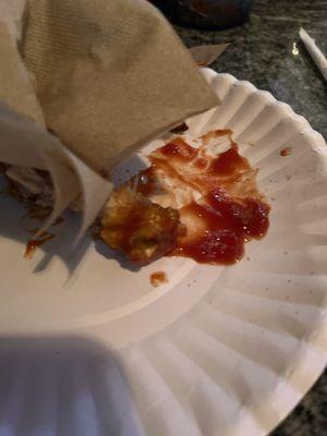 The remains of what's left of the bite of chicken wings
