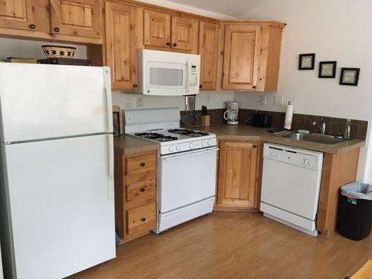 Clean kitchen with full size fridge, oven & dishwasher!
