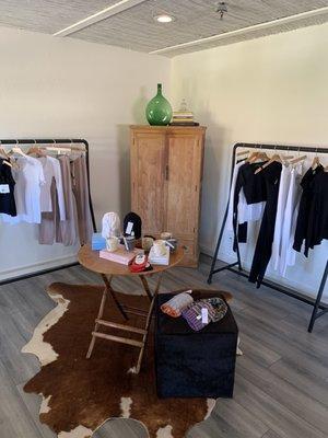 Inside retail shop! Great selection of athletic wear, books, candles, and hand-knitted beanies!