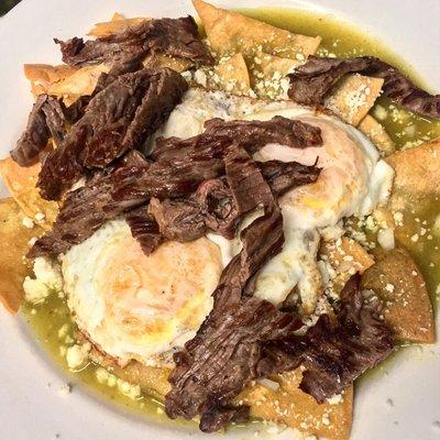 Breakfast, chilaquiles verdes/green Sauce with carne azada and two eggs