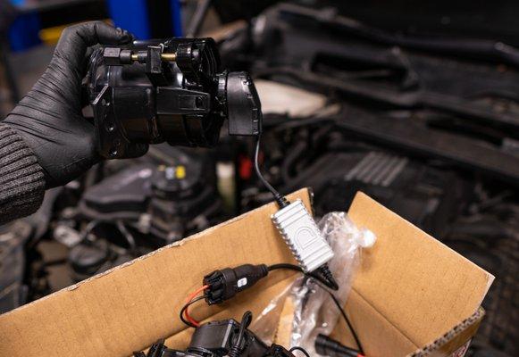 BMW E90 fog lights getting Diode Dynamics LEDs installed